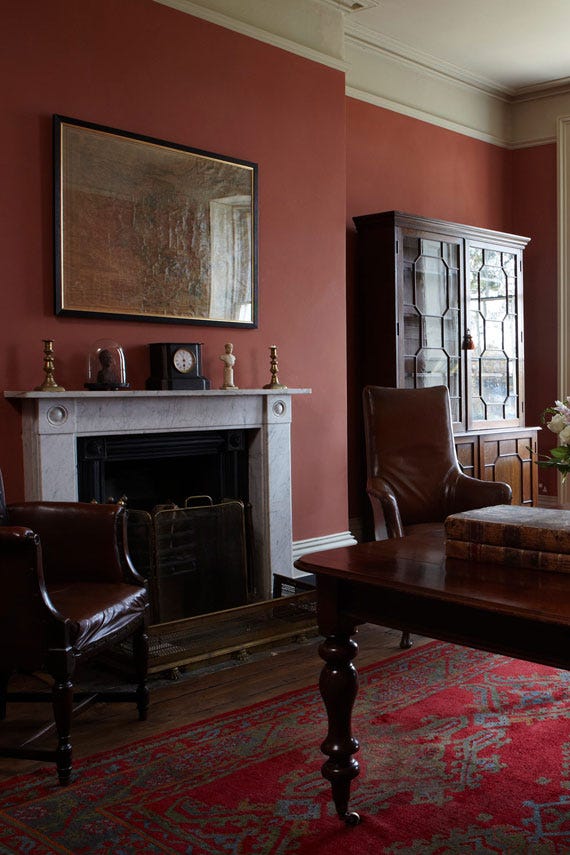 Book Room Red No.50 by Farrow & Ball on a painted wall in a room setting