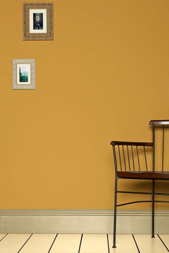 Sudbury Yellow No.51 by Farrow & Ball on a painted wall in a room setting