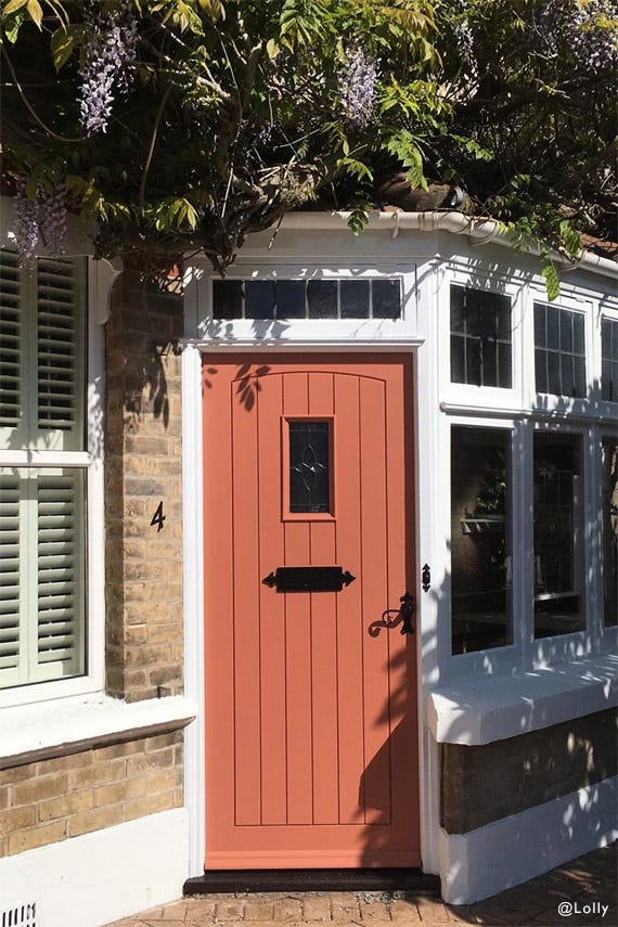 Red Earth No.64 by Farrow & Ball on a painted wall in a room setting