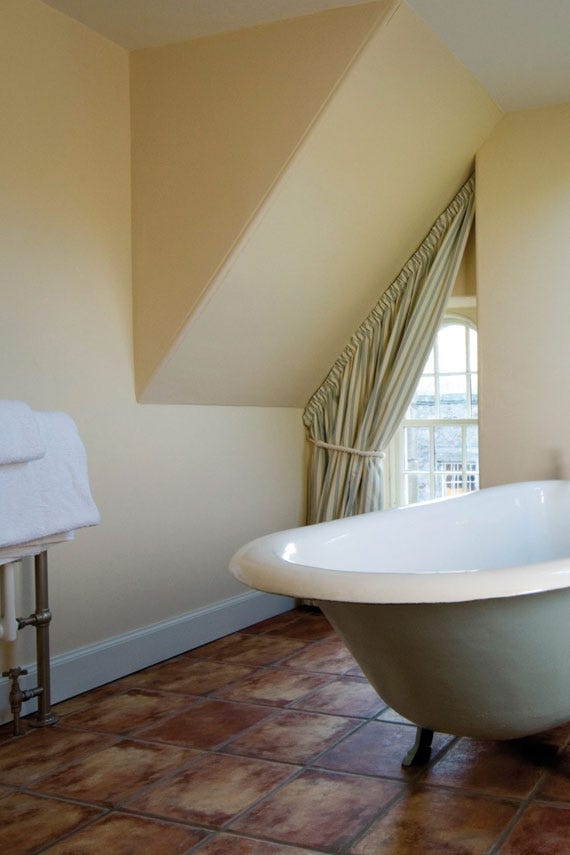 Farrow's Cream No.67 by Farrow & Ball on a painted wall in a room setting