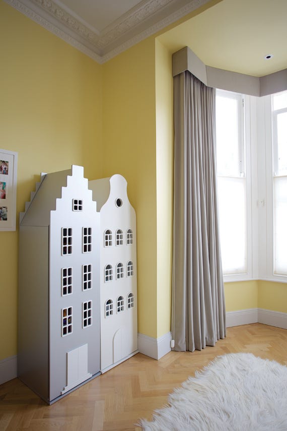Pale Hound No.71 by Farrow & Ball on a painted wall in a room setting