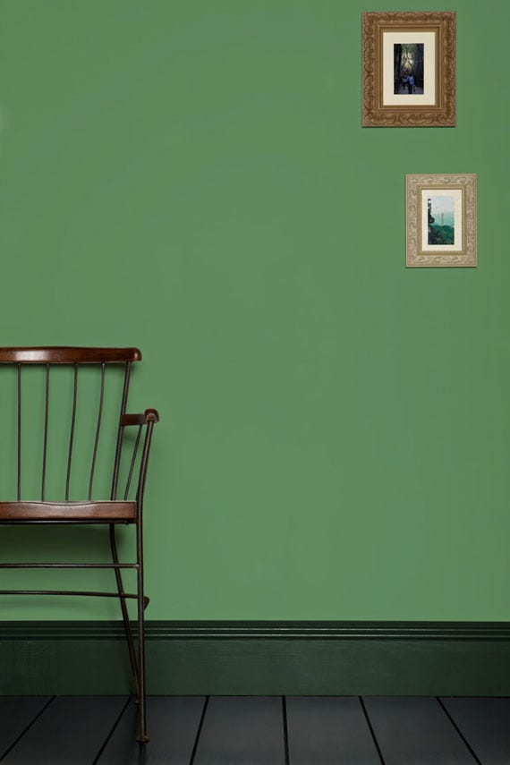 Folly Green No.76 by Farrow & Ball on a painted wall in a room setting