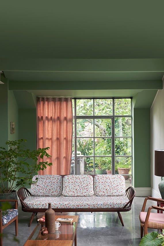 Suffield Green No.77 by Farrow & Ball on a painted wall in a room setting