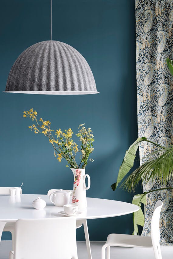 Sloe Blue No.87 by Farrow & Ball on a painted wall in a room setting