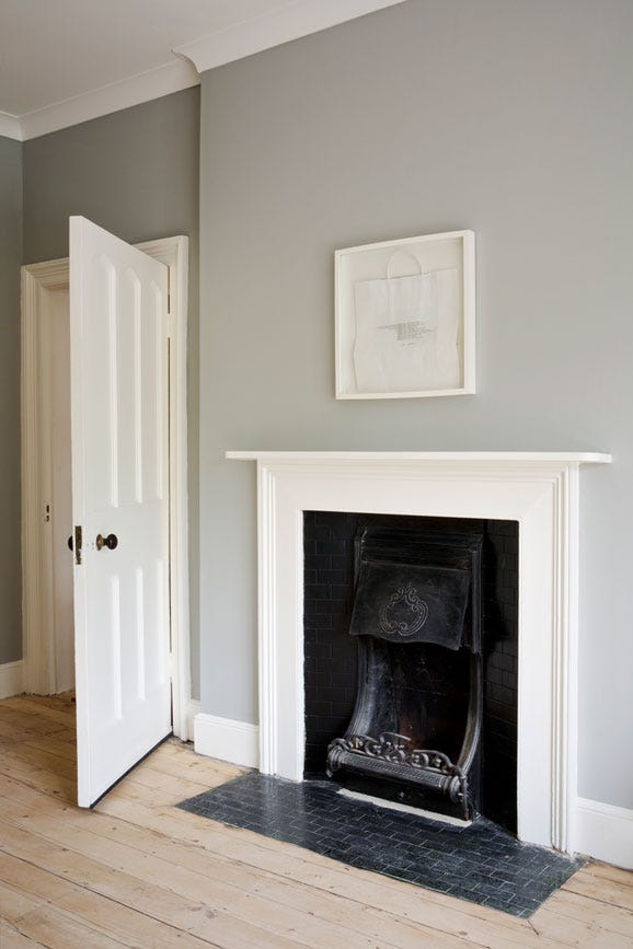 Lamp Room Gray No.88 by Farrow & Ball on a painted wall in a room setting
