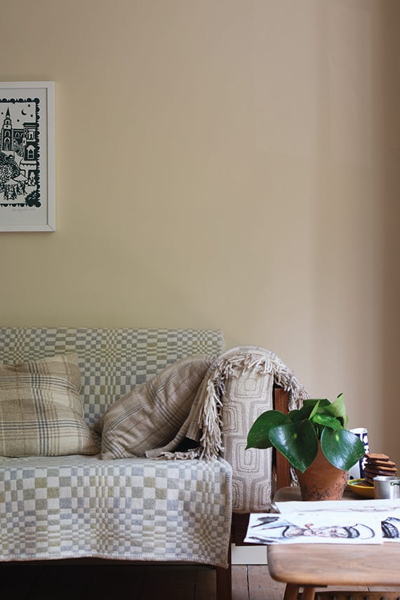 Orange Coloured White No.W5 by Farrow & Ball on a painted wall in a room setting