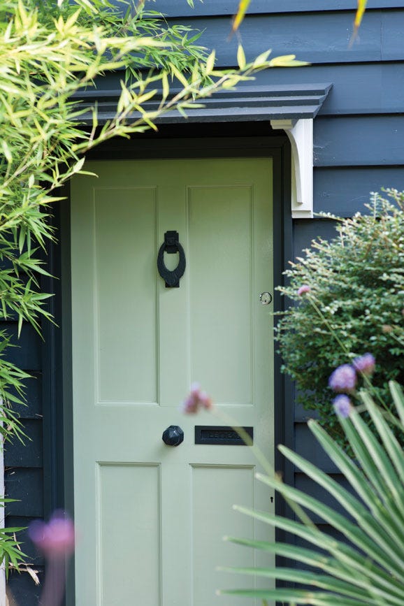 Green Ground No.206 by Farrow & Ball on a painted wall in a room setting