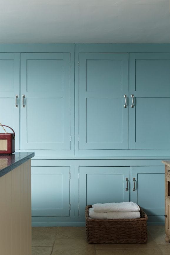 Blue Ground No.210 by Farrow & Ball on a painted wall in a room setting