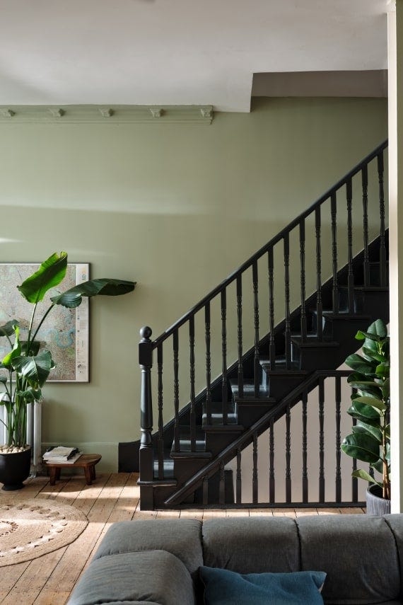 Vert de Terre No.234 by Farrow & Ball on a painted wall in a room setting