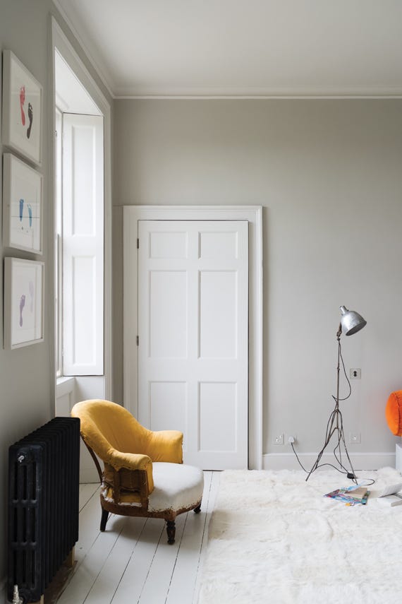 Skimming Stone No.241 by Farrow & Ball on a painted wall in a room setting