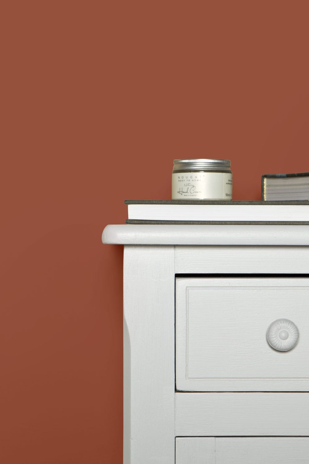 Terre d'Egypte No.247 by Farrow & Ball on a painted wall in a room setting