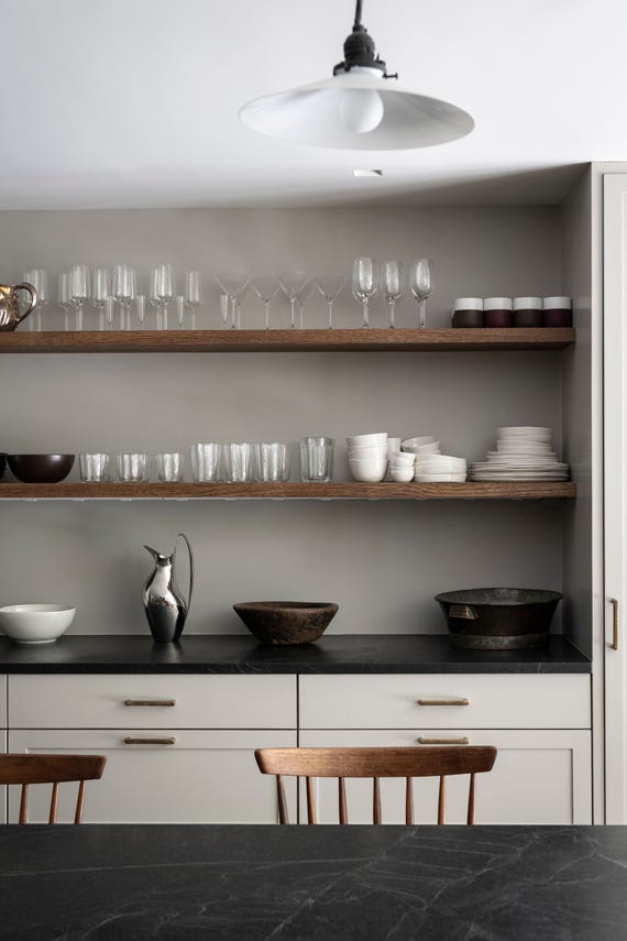 Purbeck Stone No.275 by Farrow & Ball on a painted wall in a room setting