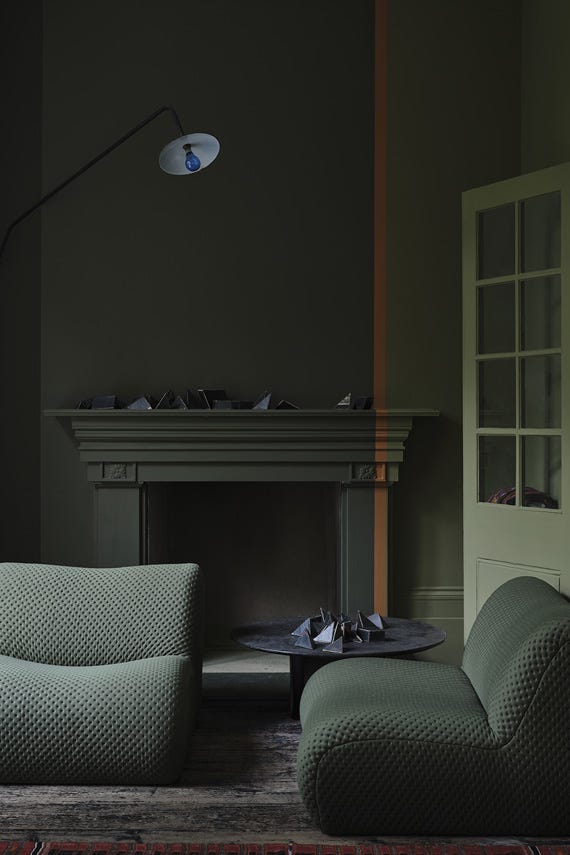 Reduced Green No.313 by Farrow & Ball on a painted wall in a room setting