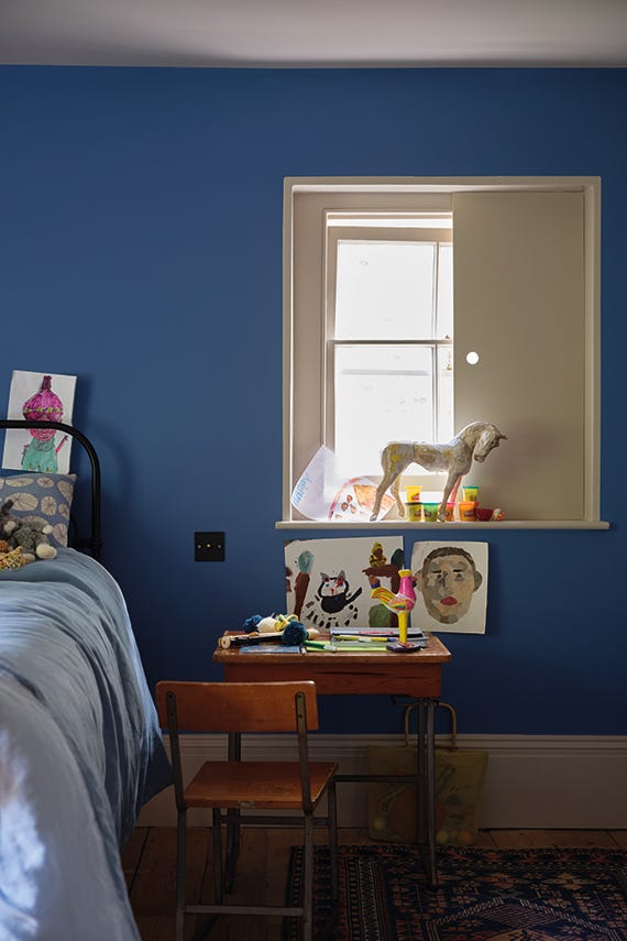Ultra Marine Blue No.W29 by Farrow & Ball on a painted wall in a room setting