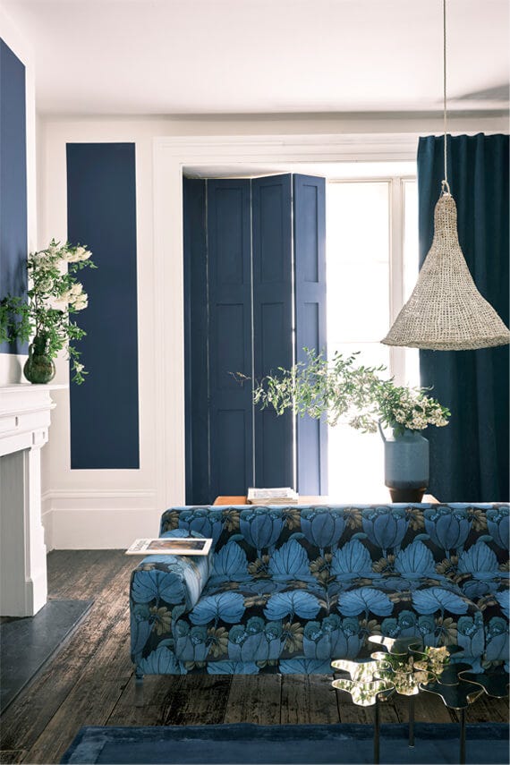 Serge No.9919 by Farrow & Ball on a painted wall in a room setting